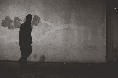 Full length of woman standing in pond