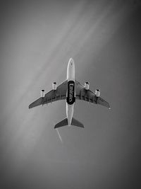 Low angle view of airplane flying in sky