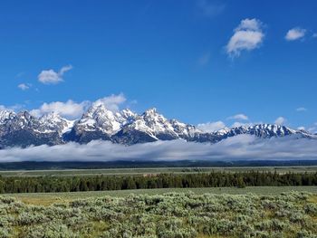 Scenic view of snowcapped mountains against sky