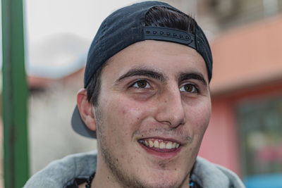 Close-up portrait of smiling young man