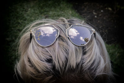 Rear view of woman with sunglasses in hair