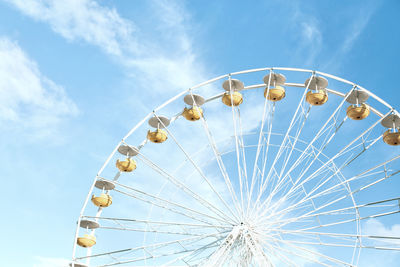 Low angle view of ferris wheel against sky