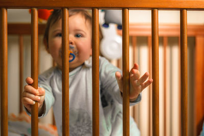 Cute baby boy in crib