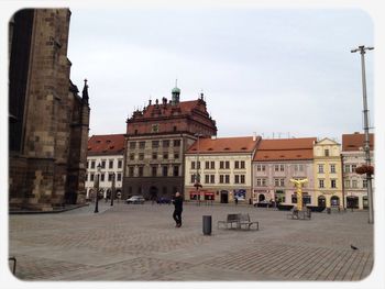 Buildings in city against sky