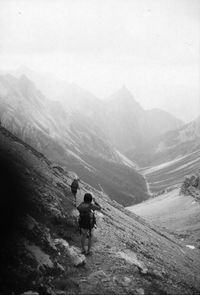 Rear view of man standing on mountain