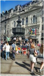 Tourists in front of building