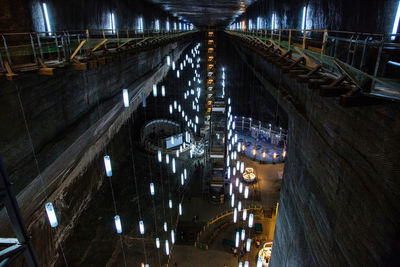 High angle view of footbridge over road at night