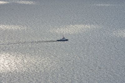 High angle view of boat sailing in sea