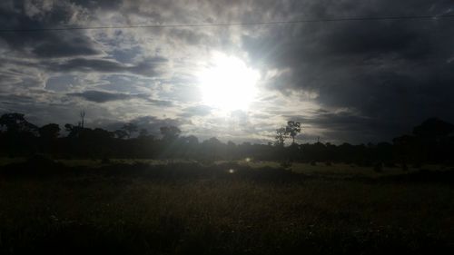 Scenic view of landscape against cloudy sky