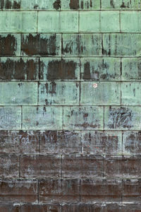 Oxidized copper folded sheet metal on roof. copper wall texture background. with marks and scrawls.