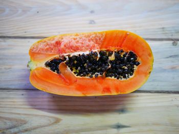 Close-up of orange slice on table