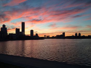 Silhouette of city at sunset