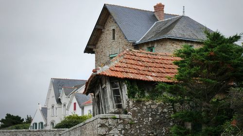 Low angle view of houses against sky