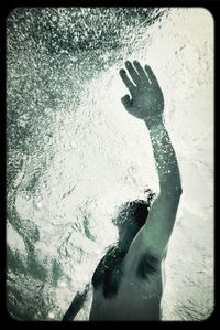 Woman standing by railing