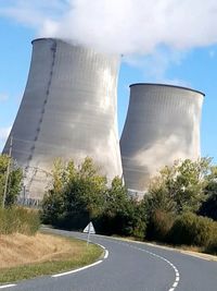 Low angle view of smoke stack against sky