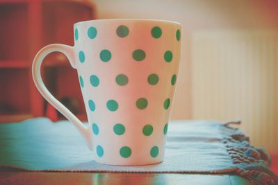 Close-up of coffee cup on table