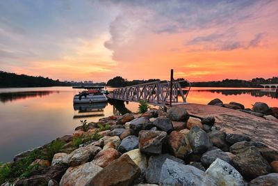 Scenic view of lake against sky during sunset