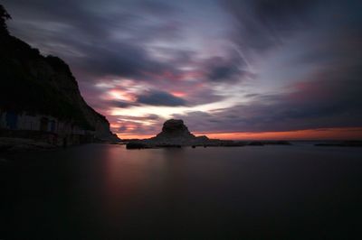 Scenic view of sea against sky at sunset