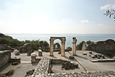 View of cemetery by sea against sky