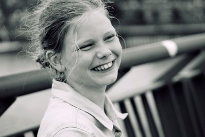 Close-up portrait of smiling young woman