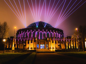 Illuminated fountain at night