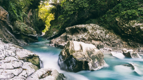 Scenic view of river amidst rocks