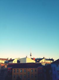 High section of buildings against blue sky