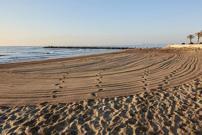 Scenic view of beach against clear sky