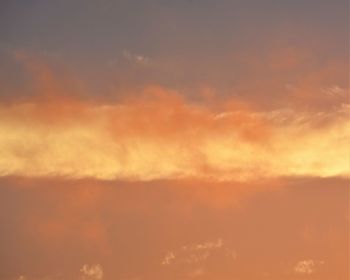 Low angle view of cloudy sky during sunset