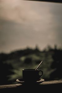 Close-up of coffee on table against sky