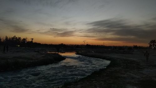 Scenic view of sunset over city