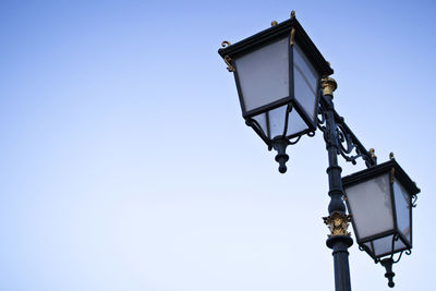 Low angle view of street light against clear sky