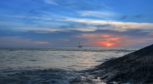 Scenic view of sea against sky during sunset