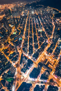 High angle view of city lit up at night