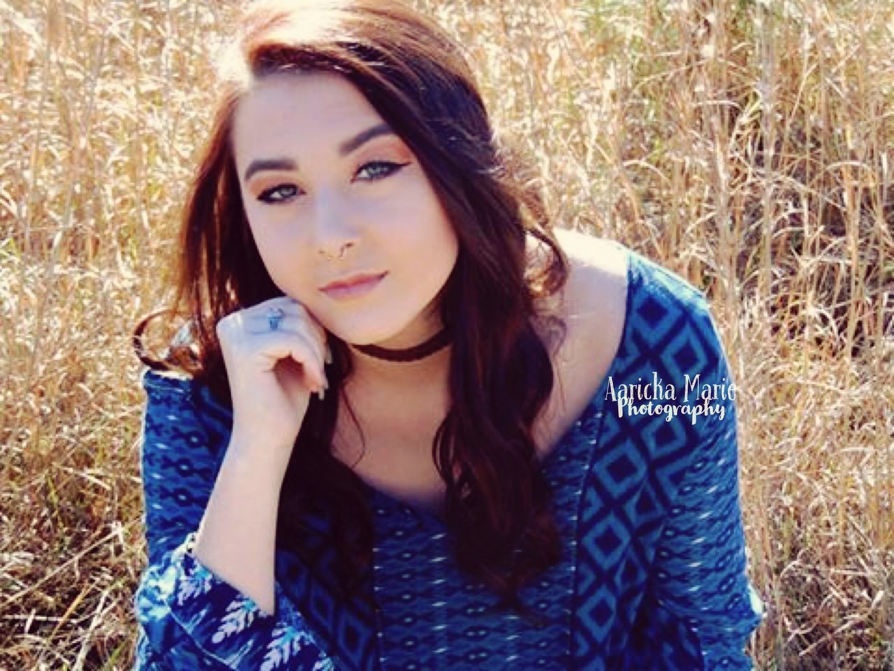 beautiful woman, looking at camera, portrait, long hair, grass, one person, beauty, young adult, outdoors, one young woman only, front view, beautiful people, field, redhead, sunlight, day, only women, headshot, blue, adult, people, real people, adults only, young women, one woman only, nature, close-up