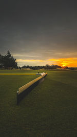 Scenic view of land against sky during sunset