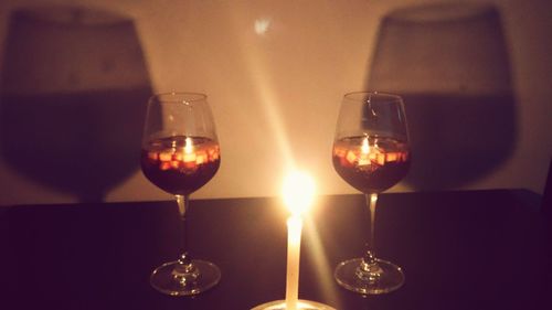 Close-up of wine glasses on table