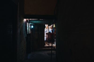 Man standing in corridor of building