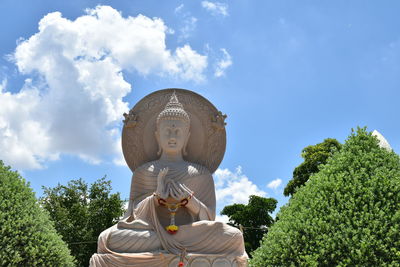 Low angle view of statue against sky