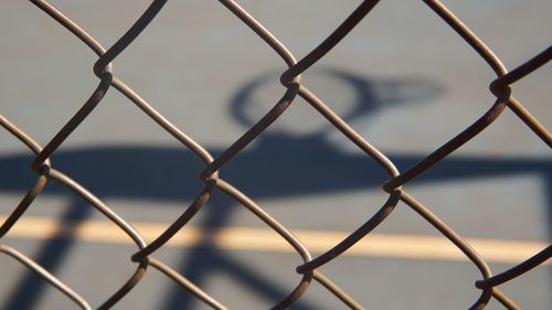 Full frame shot of chainlink fence against sky