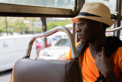 Man looking away in car