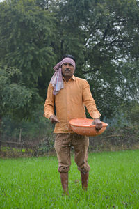 Full length of man standing on field