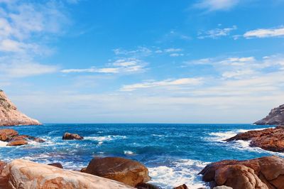 Scenic view of sea against blue sky