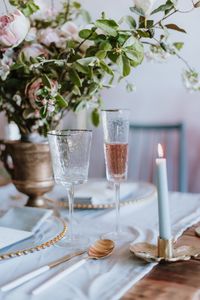 Glass of potted plant on table