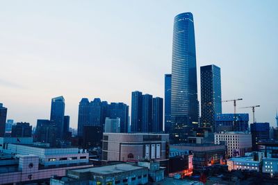 Modern buildings in city against sky