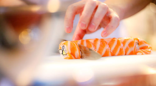 Close-up of hand holding fish