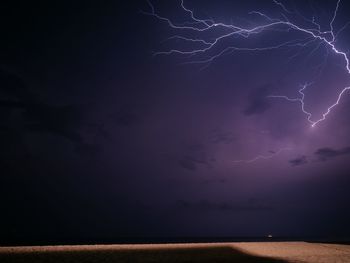 Scenic view of lightning in sky at night