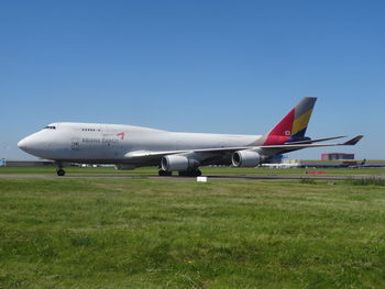 Airplane flying against clear blue sky