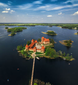 High angle view of river and buildings against sky