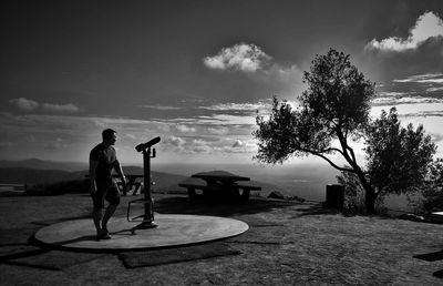 Full length of woman standing against sky